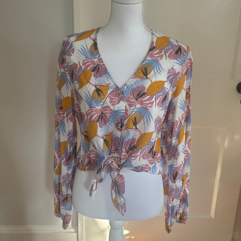 A tropical-print long-sleeve blouse